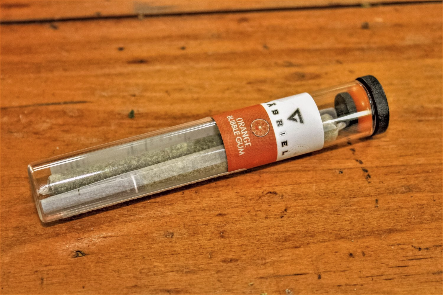 A pre-roll in a glass joint tube with a Gabriel branded label