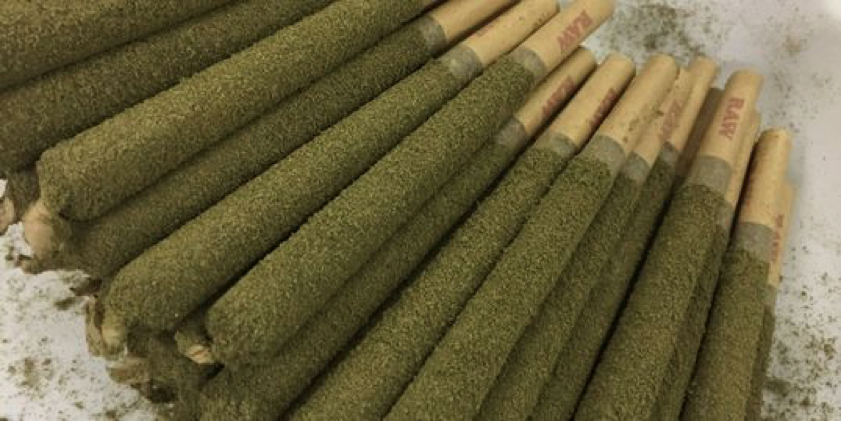 a pile of pre-rolls coated in kief