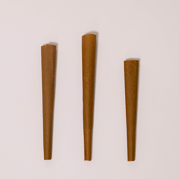three hemp wrap blunt cones lying on a white background